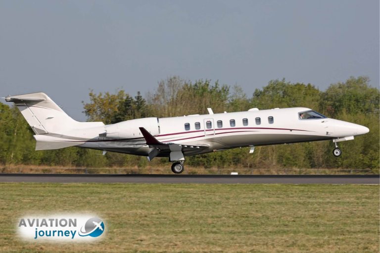 Lear-Jet-Aircraft-flying-above-clouds-in-clear-skies