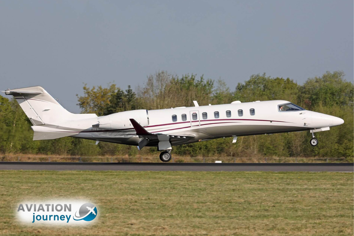 Lear-Jet-Aircraft-flying-above-clouds-in-clear-skies