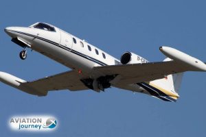 Lear-Jet-Aircraft-flying-above-clouds-in-clear-skies